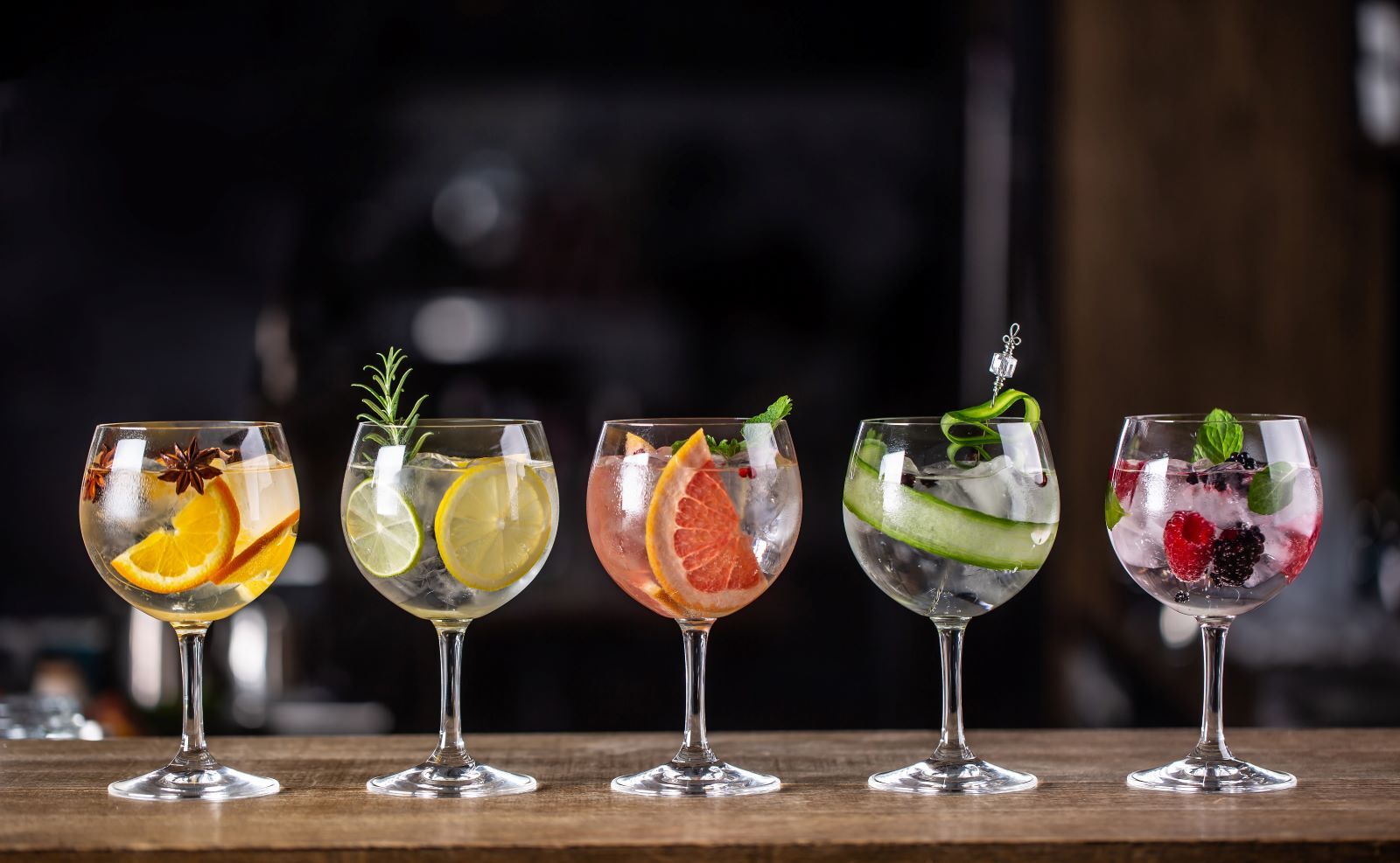 fancy cocktails with different types of fruit