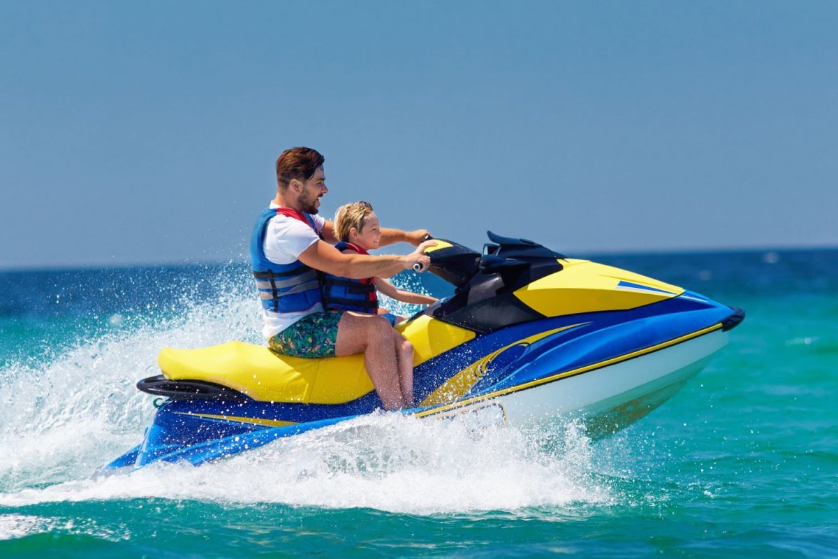 People riding a jet ski in the ocean