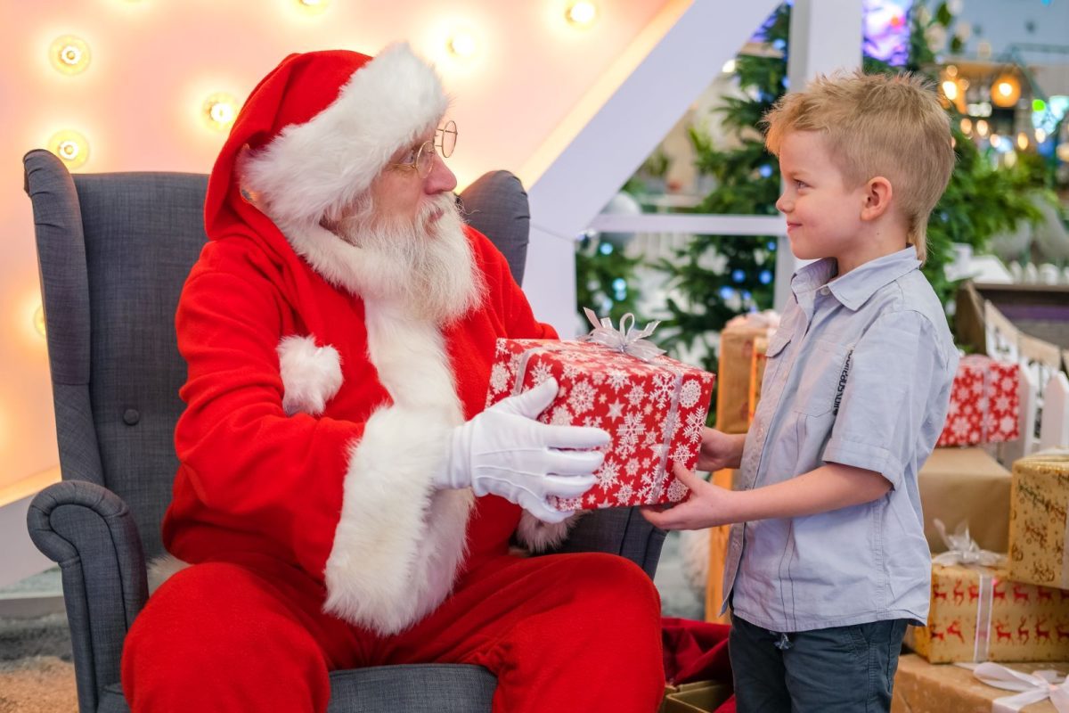 Santa giving a gift to a child